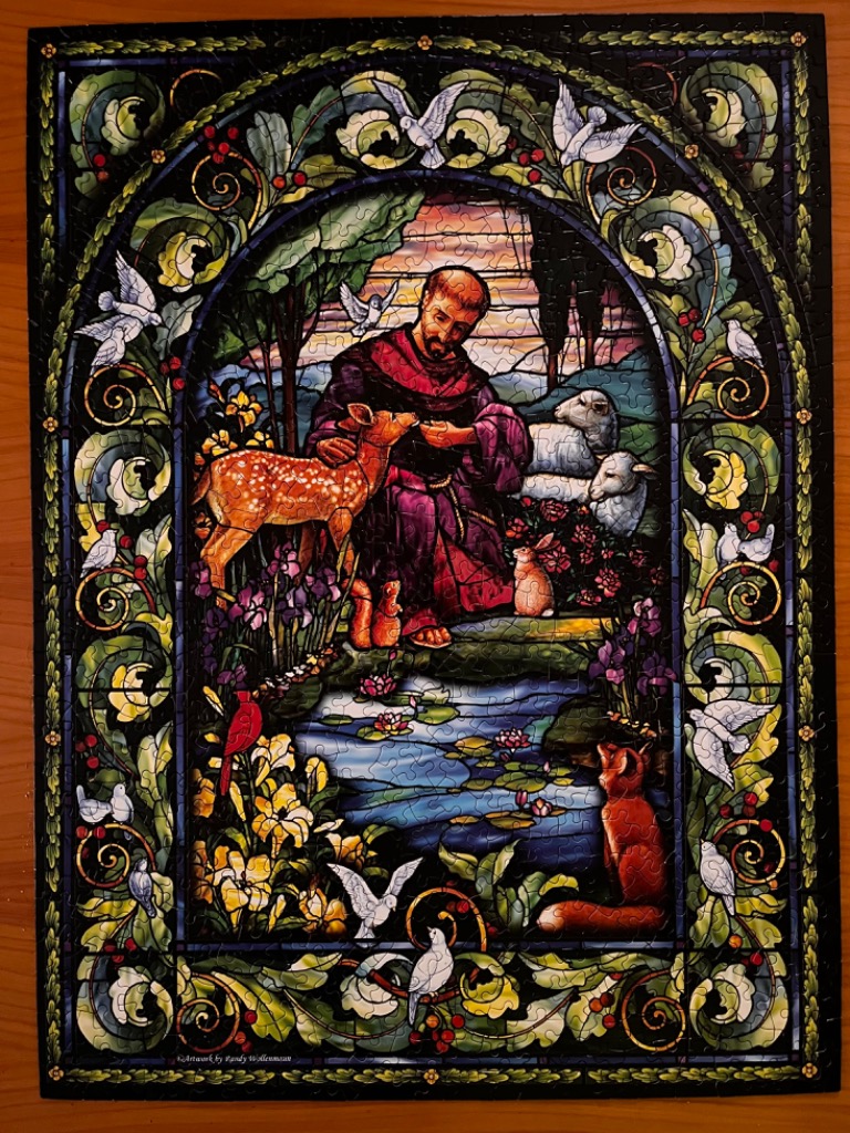 Stained glass style illustration of Saint Francis of Assisi surrounded by animals in a garden.