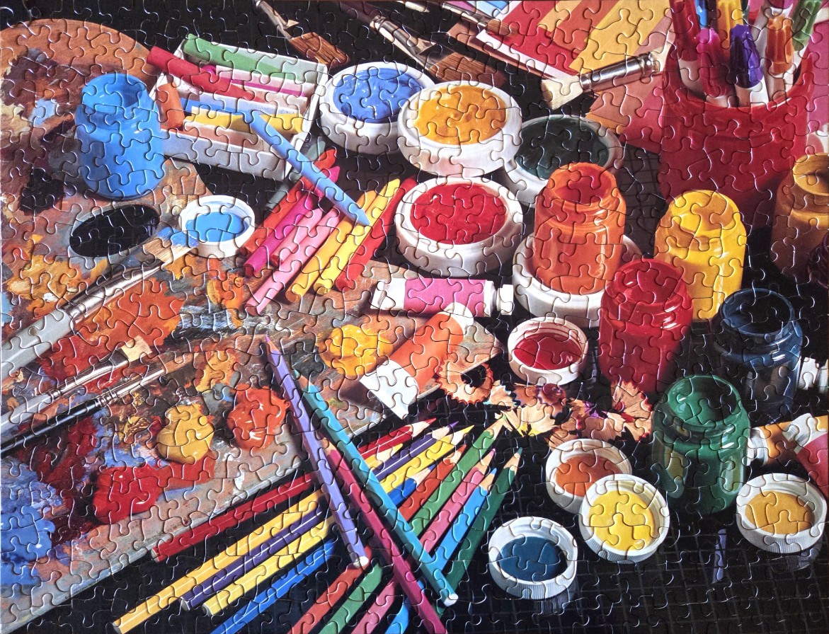A high-angle view of a cluttered artist