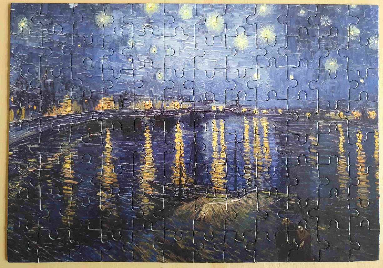 An oil painting style image of a star-filled night sky over a river reflecting city lights.