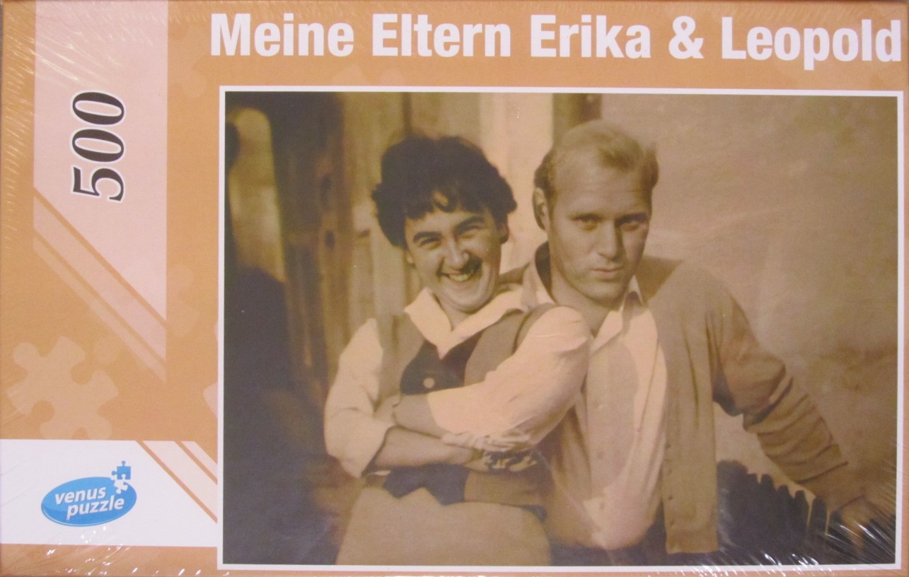 A vintage, sepia-toned photograph of a man and woman leaning together, titled Meine Eltern Erika & Leopold.