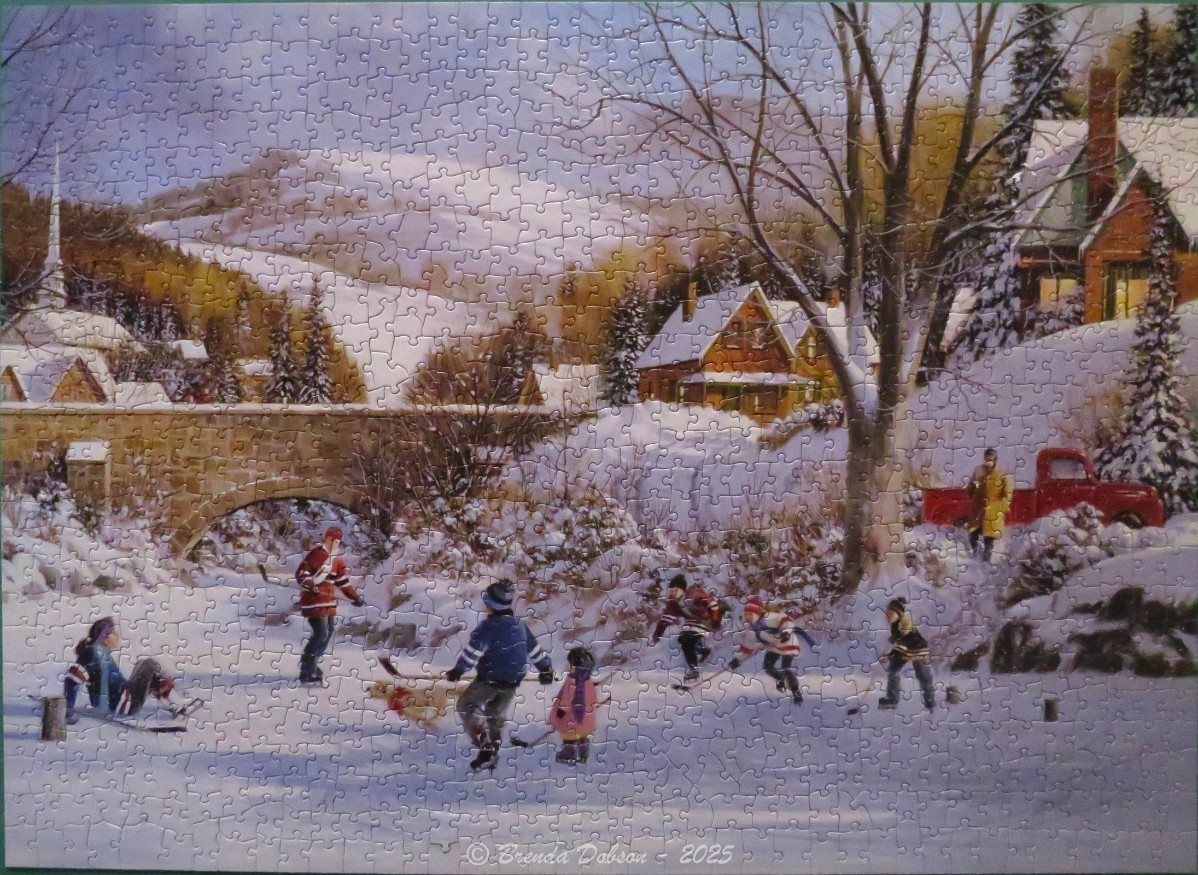 A nostalgic winter scene of children playing ice hockey on a frozen pond near a stone bridge and snow-covered village.