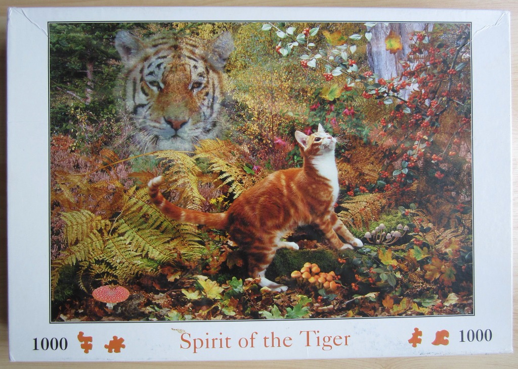An orange tabby cat standing in an autumn forest with a ghostly, translucent image of a tiger's face in the background.