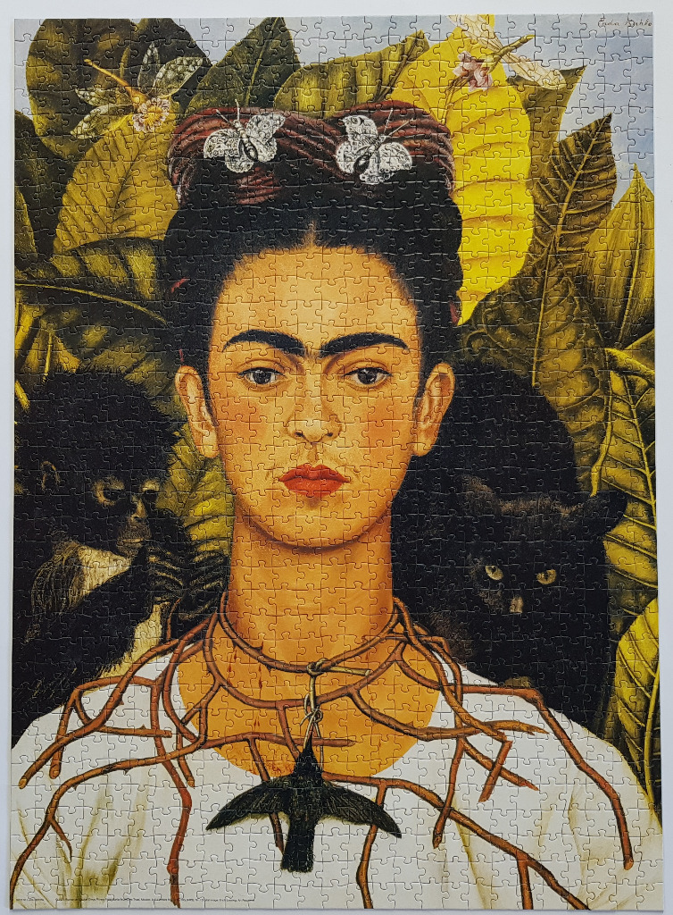 Self-portrait of Frida Kahlo with a thorn necklace, hummingbird, monkey, and black cat.