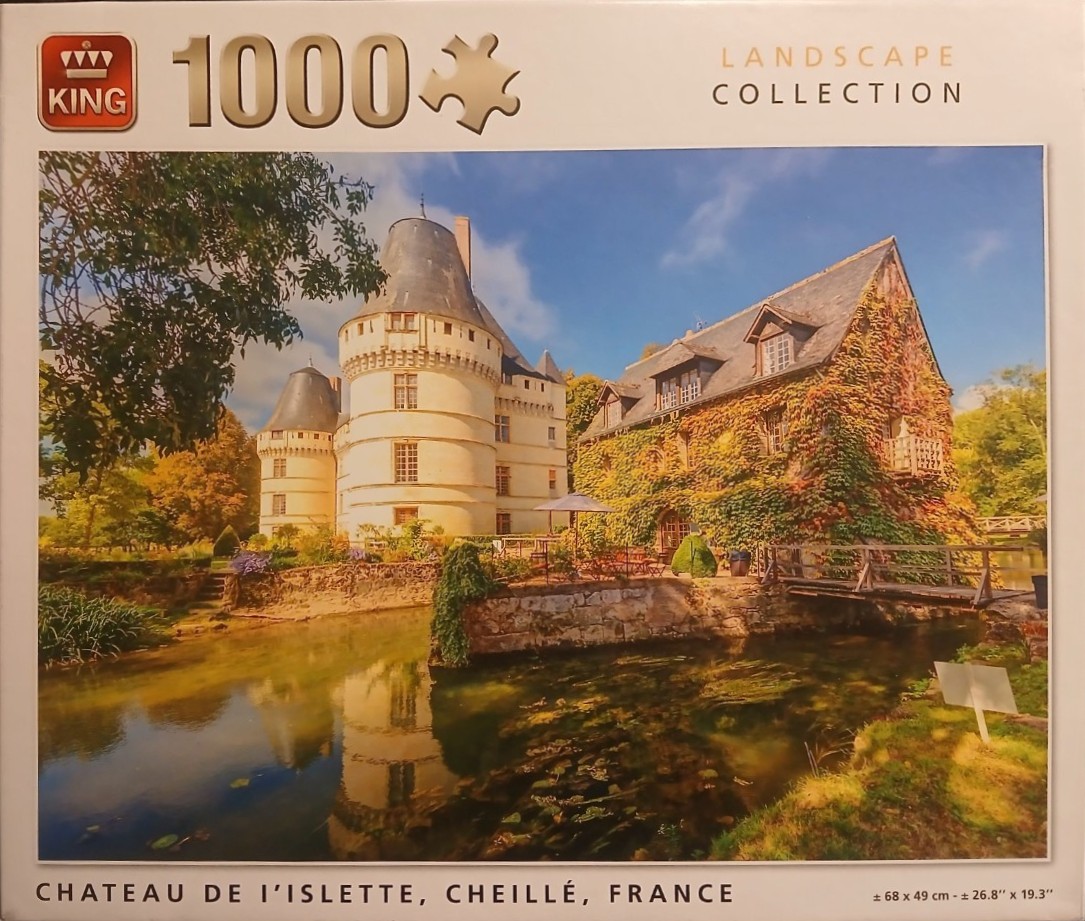 A sunny, picturesque view of the historic Chateau de l'Islette in France surrounded by a water-filled moat.