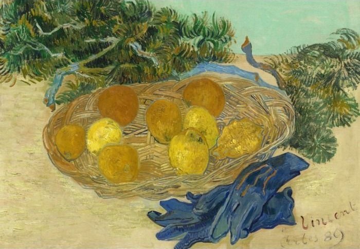 Still life painting of a wicker basket filled with yellow lemons and oranges beside a pair of dark blue gloves.