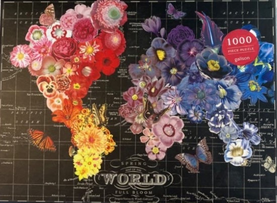 A world map created from colorful flower clusters against a black grid background.