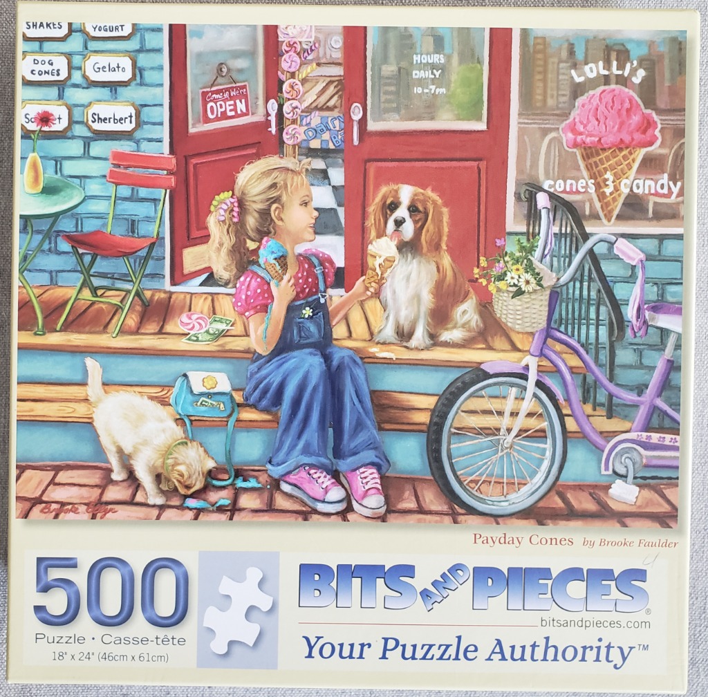 A young girl in blue overalls sits on a shop porch sharing ice cream with a Cavalier King Charles Spaniel.