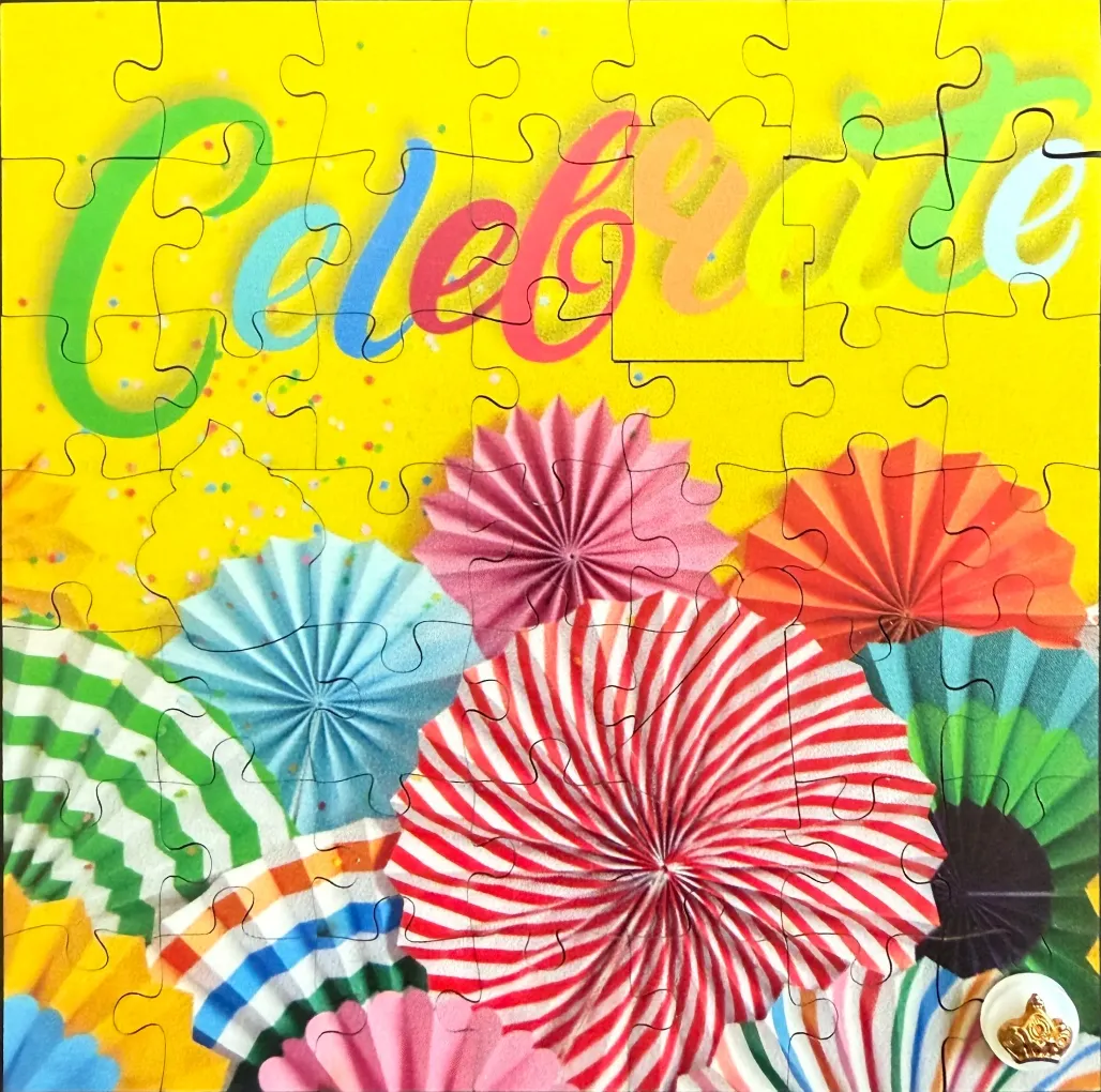 The word Celebrate in cursive above colorful, folded paper fan decorations on a bright yellow background.