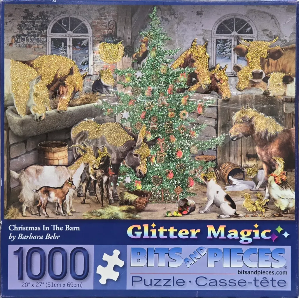 A barn interior scene featuring farm animals and a Christmas tree, decorated with gold glitter accents.