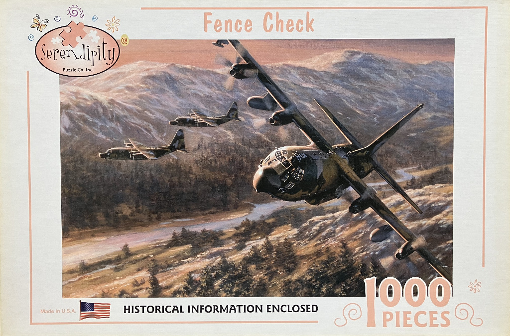 Three military transport aircraft flying in formation over a mountainous river valley at sunset.