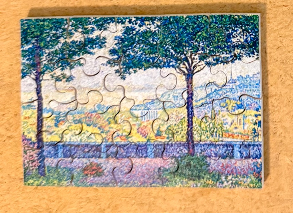 An impressionist-style landscape painting featuring two prominent trees framing a distant town and valley.