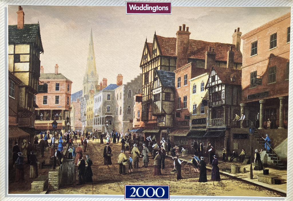 A Victorian street scene with half-timbered buildings and a distant church spire.