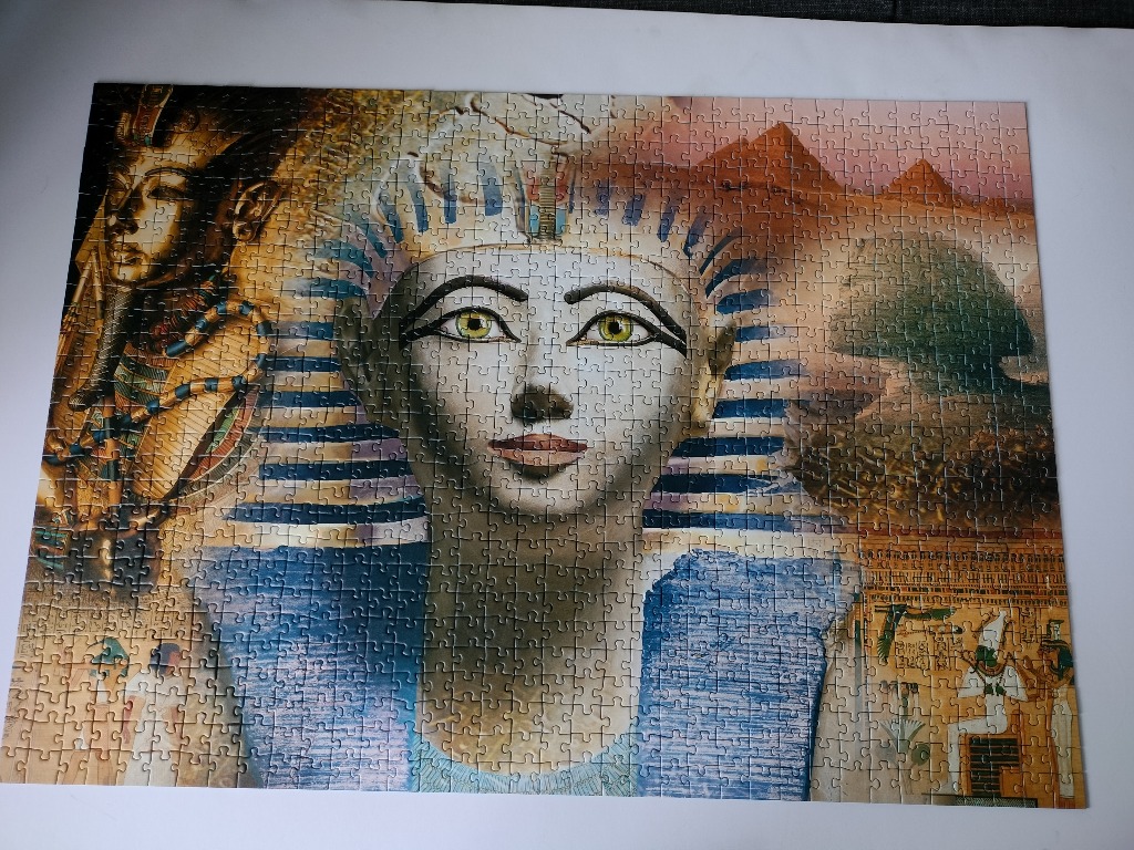 An artistic montage of Egyptian pharaohs, pyramids, and hieroglyphics.