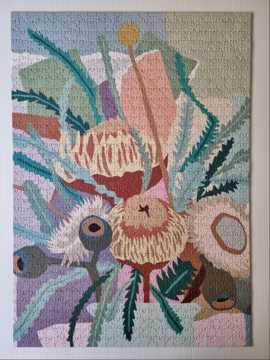 Stylized illustration of Australian native flowers in a vase with soft pastel tones.