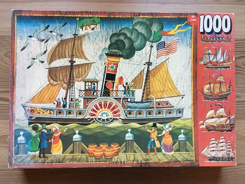 A vintage-style illustration of a 19th-century paddle steamer ship titled Victoria at a wooden pier.
