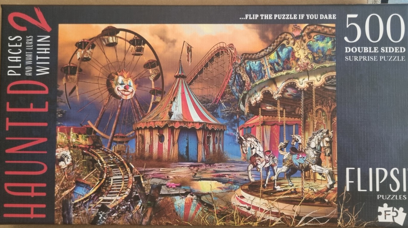 A spooky, abandoned carnival at sunset with a clown-faced ferris wheel and a carousel.
