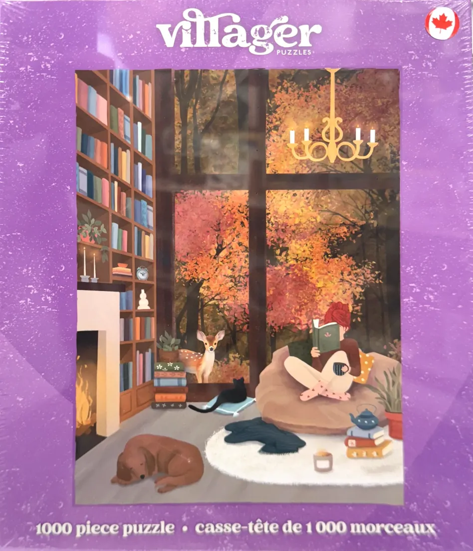 A cozy room with a person reading by a large window looking out at autumn trees, with a fireplace and pets.