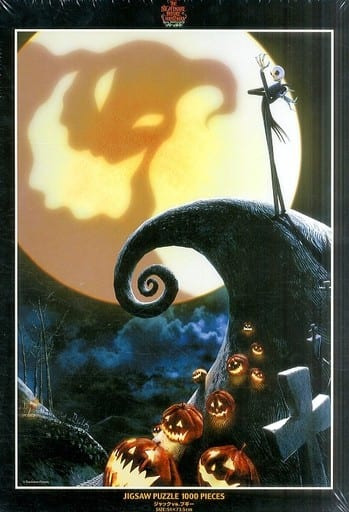 Jack Skellington standing on a spiral hill in front of a full moon with glowing jack-o'-lanterns at the base.