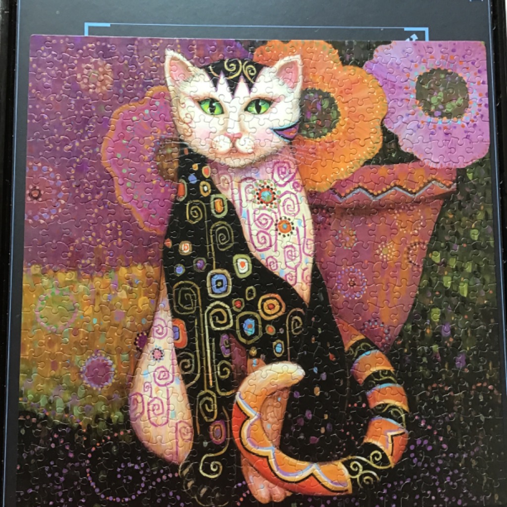 A whimsical illustration of a cat decorated with intricate gold, black, and pastel patterns against a floral background.