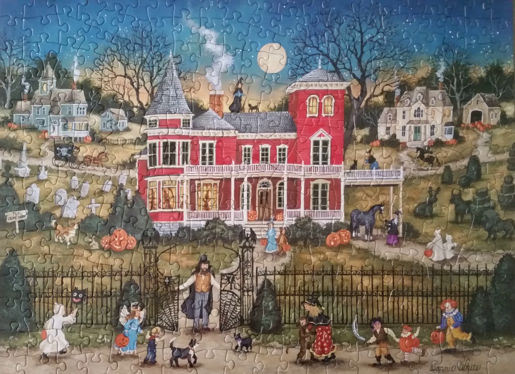 A folk art illustration of a red Victorian mansion decorated for Halloween with trick-or-treaters at the gate.