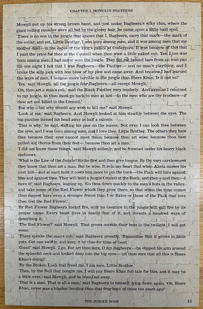 An excerpt from Chapter 1 of The Jungle Book printed on aged, parchment-like paper.