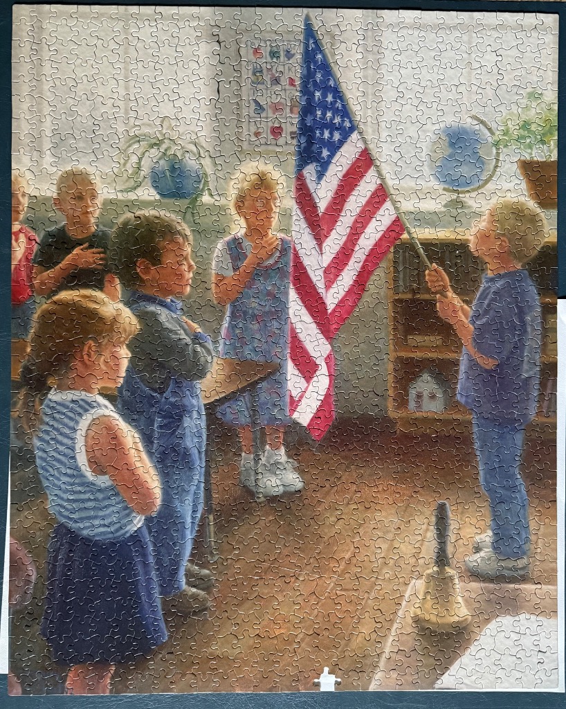 Children in a classroom reciting the Pledge of Allegiance