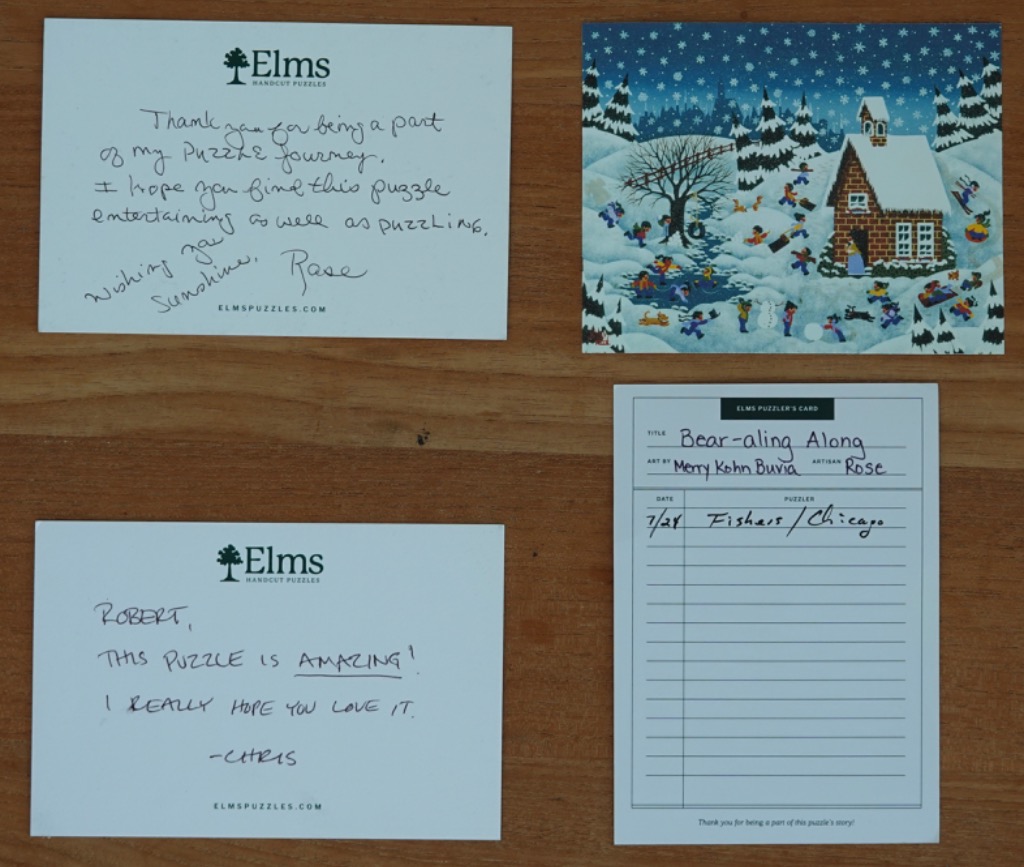 A collection of handwritten notes and a festive winter scene illustration on a wooden surface.