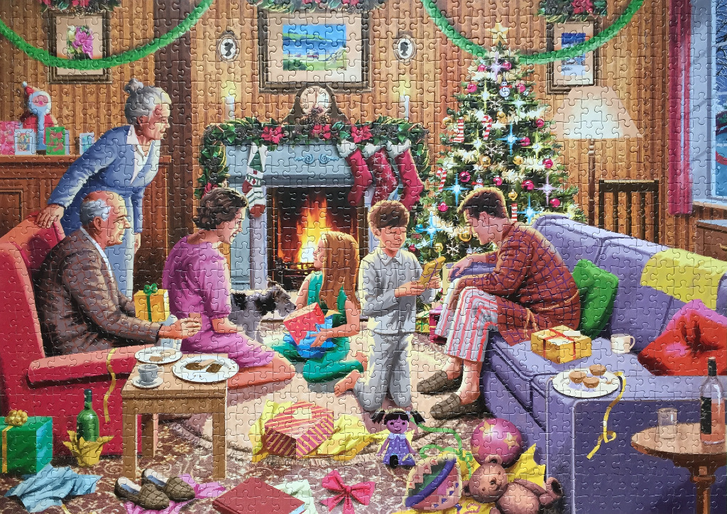 A multi-generational family celebrating Christmas in a cozy living room.