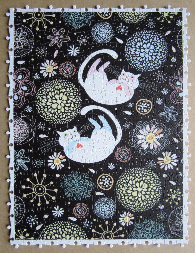 Two whimsical white cats playing amidst a field of stylized flowers on a black background.