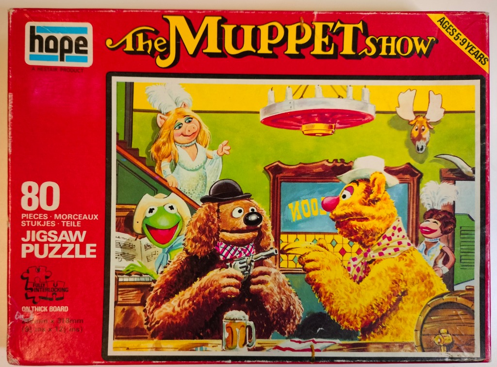 Illustration of Muppet characters in a Western saloon setting.