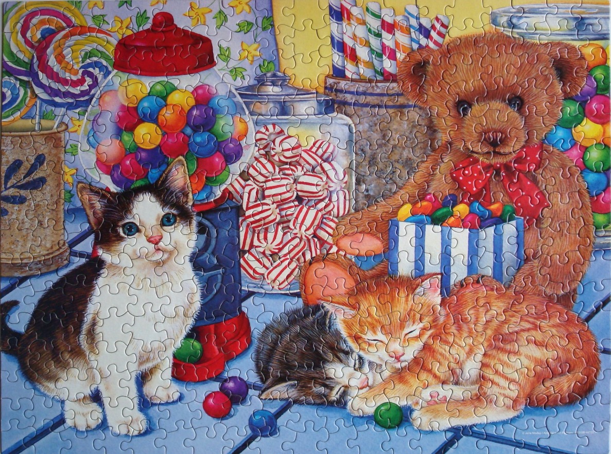A whimsical illustration of three kittens, a teddy bear, and jars of colorful candy.