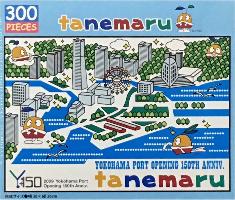 A whimsical illustrated map of the Yokohama waterfront featuring a cute orange mascot character, Tanemaru.