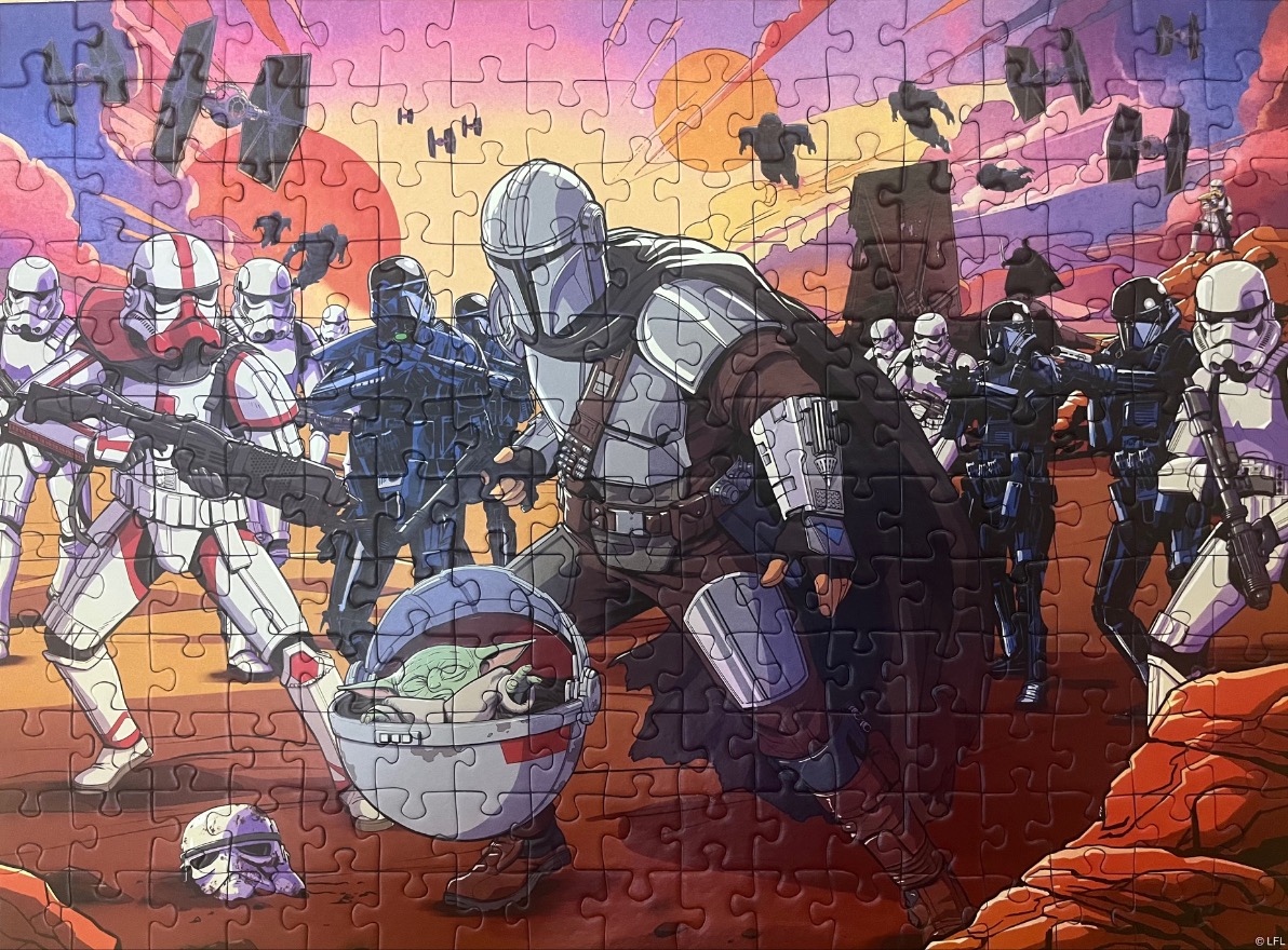 The Mandalorian and Grogu in a battle scene with troopers against a sunset sky.