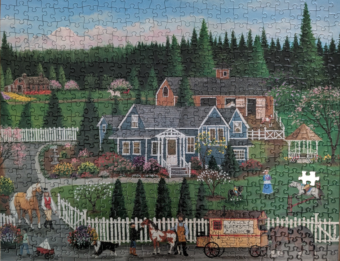 A peaceful rural painting of a blue house, horses, and a blacksmith wagon at the base of a snowy mountain range.