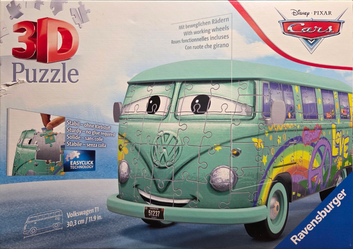 A 3D image of a cartoonish, mint-green Volkswagen T1 van with a hippie-inspired peace-and-love design.