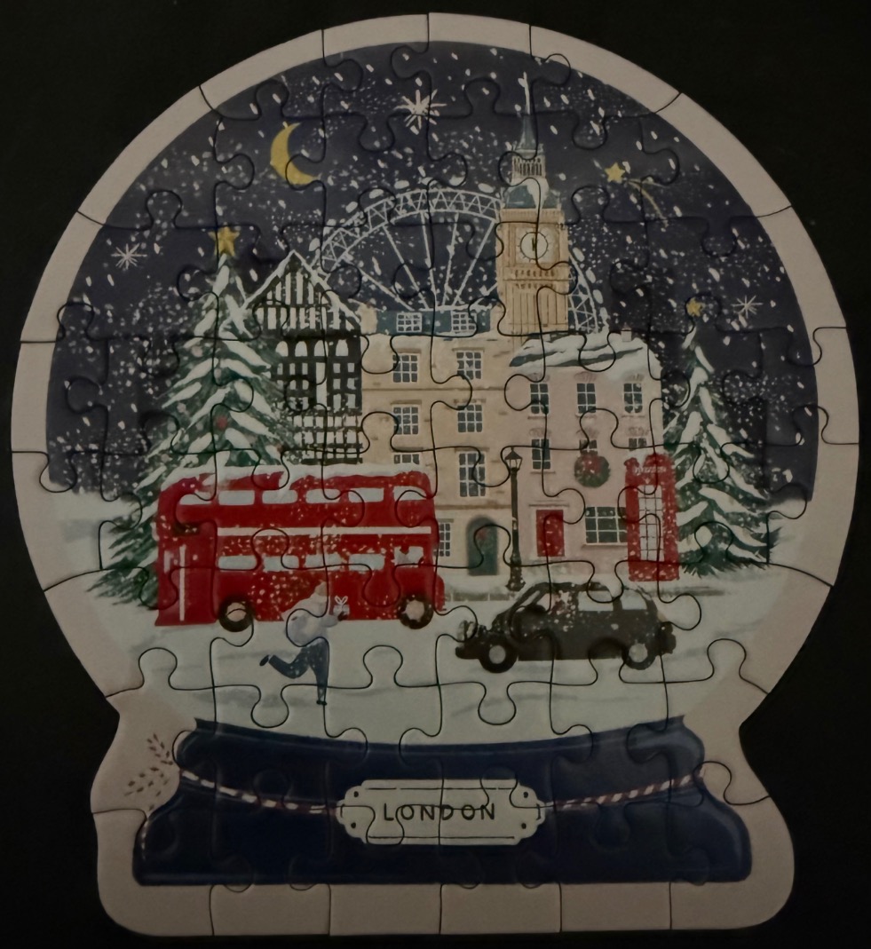 A whimsical snow globe illustration featuring a snowy night in London with a red bus and Big Ben.