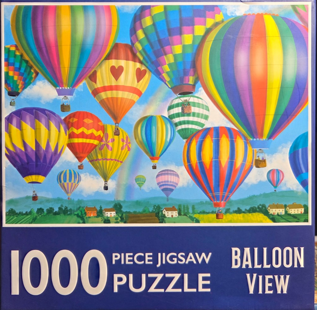 Many vibrant, multi-colored hot air balloons floating in a bright blue sky above a pastoral landscape.