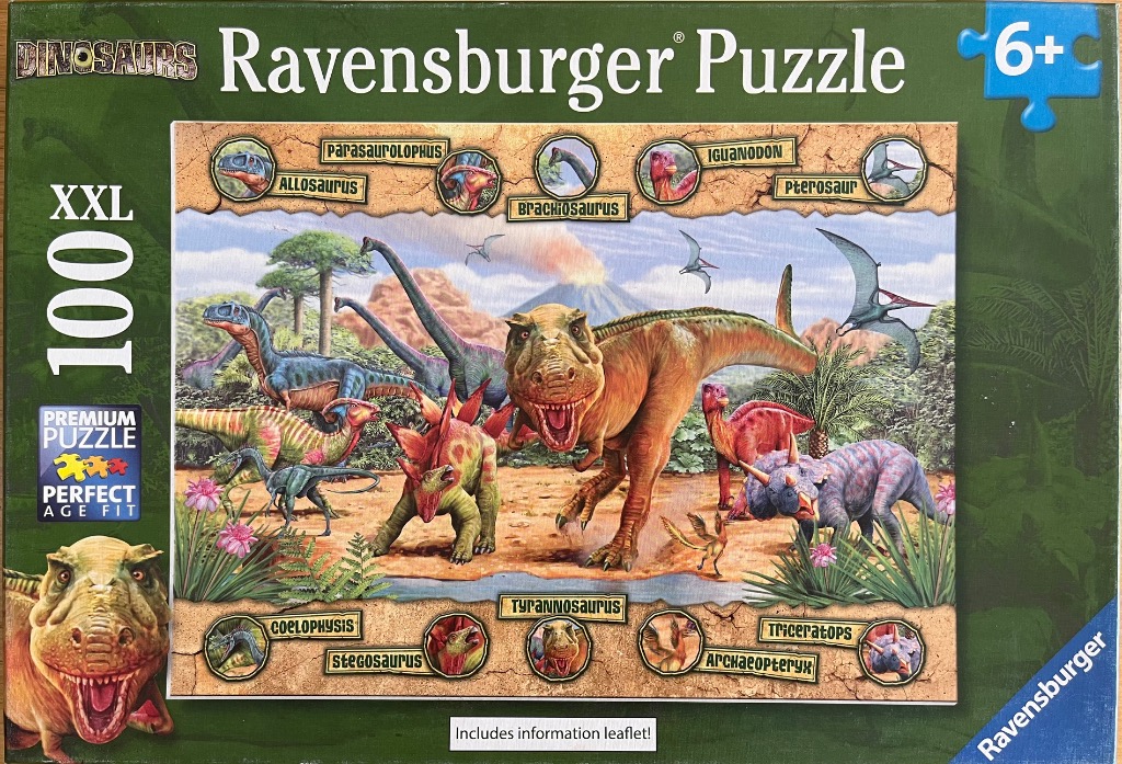 A prehistoric scene featuring a central Tyrannosaurus rex surrounded by various other dinosaurs in a volcanic landscape.