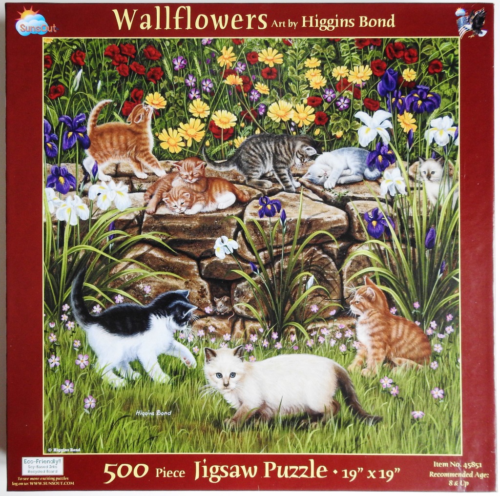 Illustration of seven kittens playing in a lush garden with a stone wall and various colorful wildflowers.