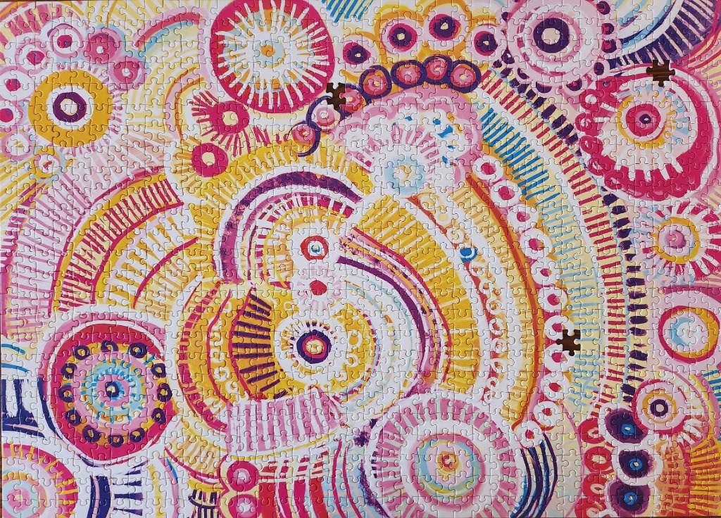 Abstract painting with circular motifs in vibrant shades of pink, yellow, and purple