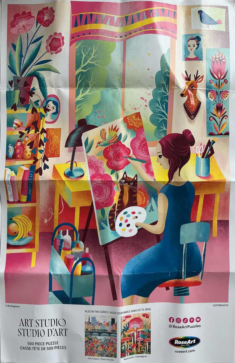 An artist in a blue dress painting flowers and a cat on a canvas in a colorful studio.