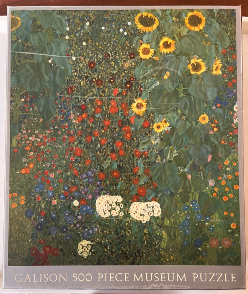 A lush, impressionistic garden filled with sunflowers and smaller red and white flowers.