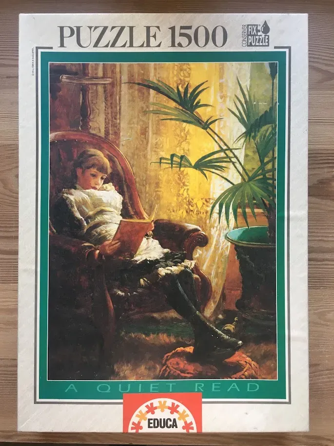 A Victorian-style painting of a young girl sitting in a velvet armchair reading a book by a window.