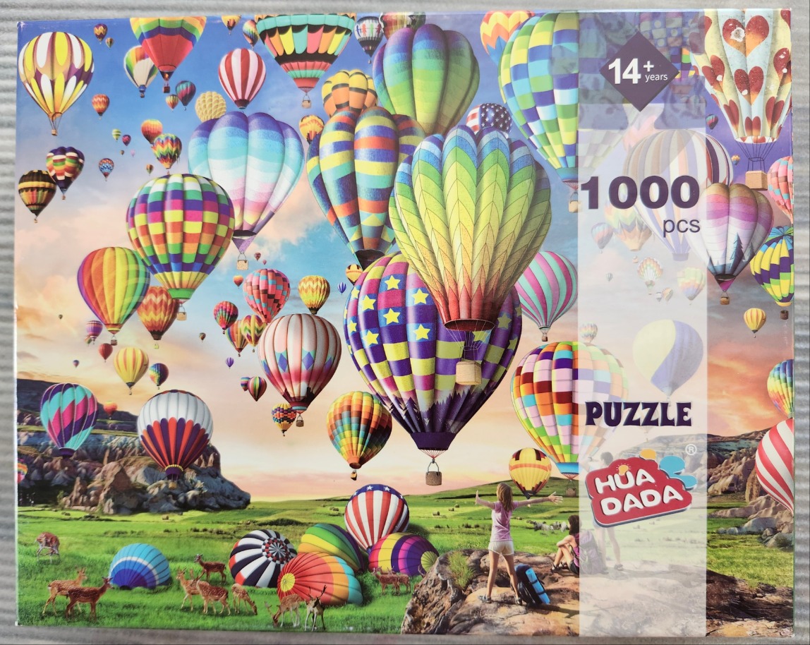 Colorful hot air balloons filling a blue and orange sky above a green landscape with deer and onlookers.