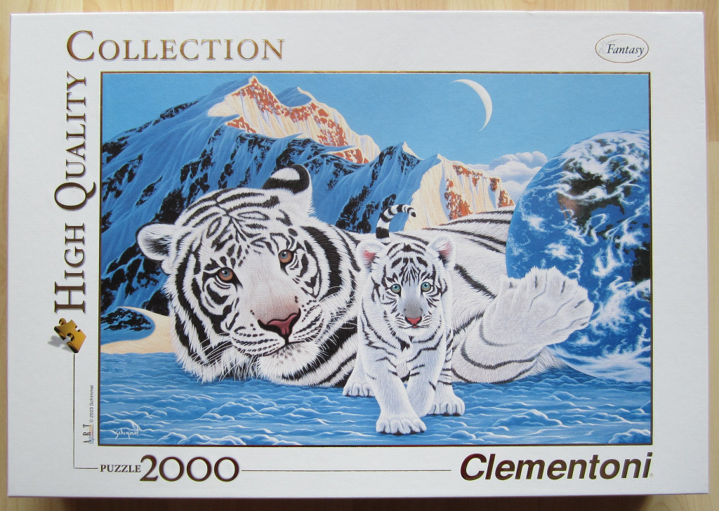 An illustration of an adult white tiger and a cub resting in front of snow-capped mountains and a globe of Earth.