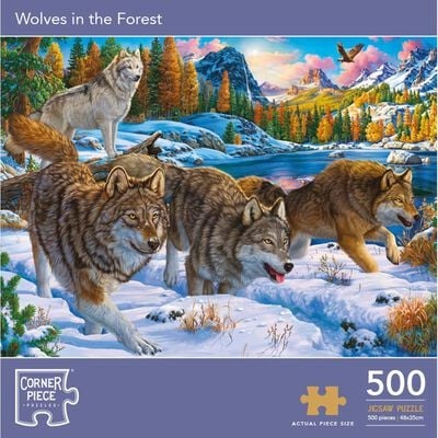 Four wolves in a snowy forest landscape with mountains in the background