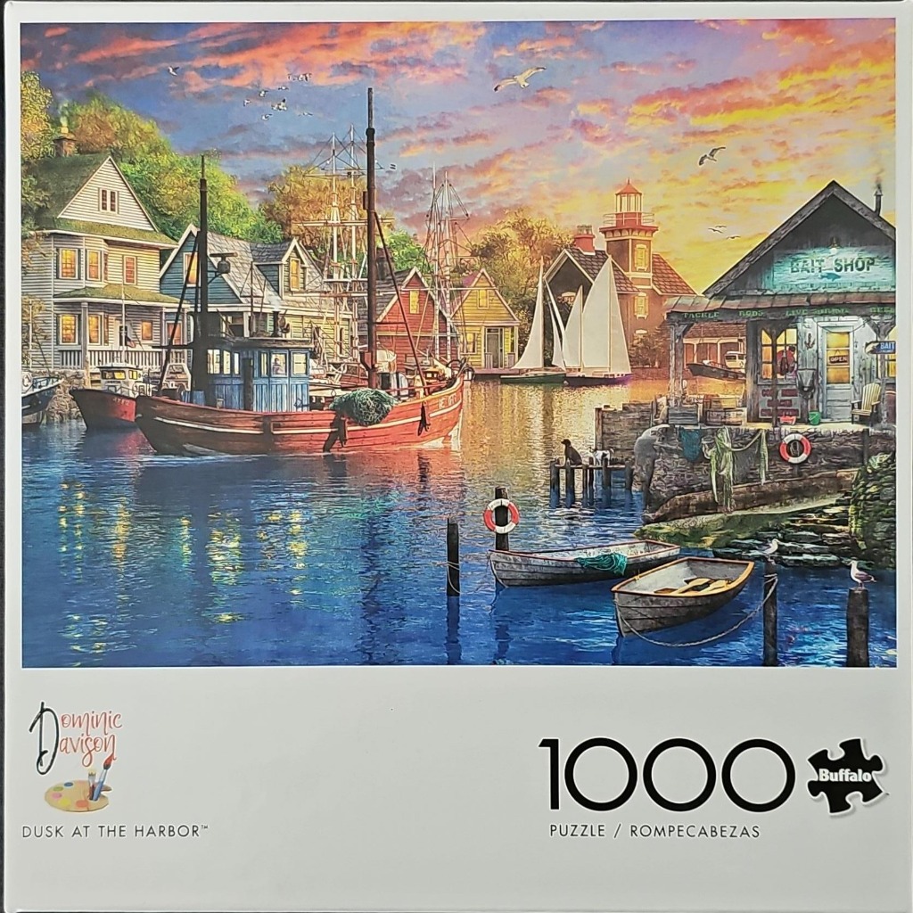 A peaceful coastal harbor scene at sunset with boats, a bait shop, and colorful houses reflecting on deep blue water.