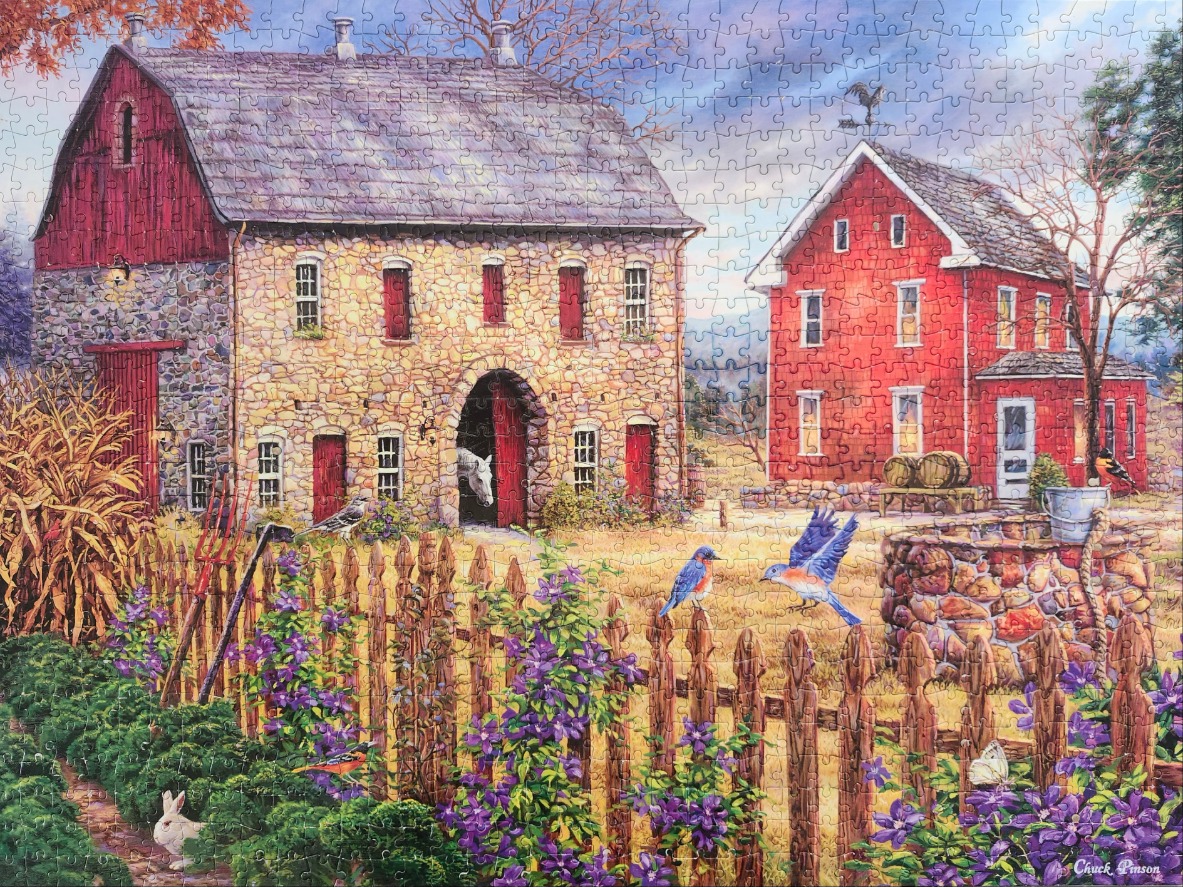 A rustic farm scene with a stone barn, red farmhouse, flower-filled fence, and birds in a peaceful autumn setting.