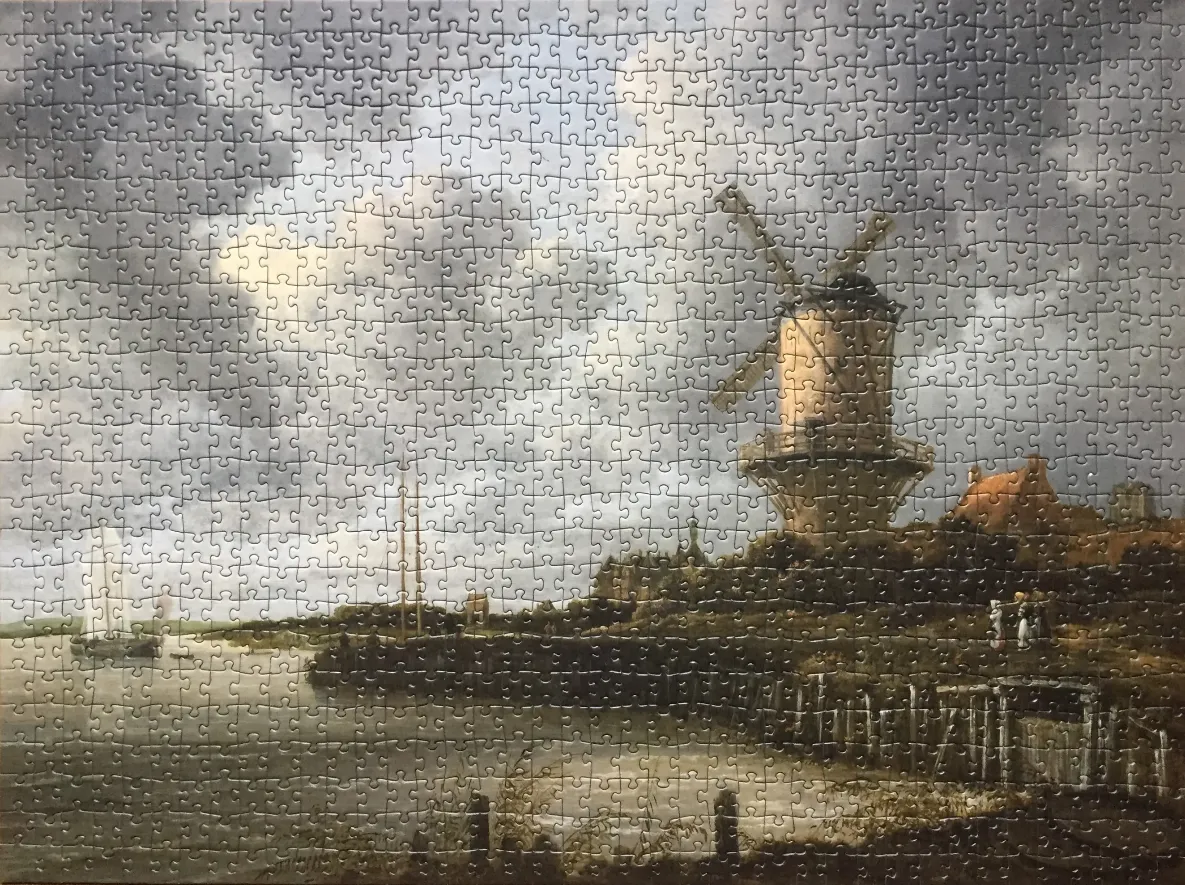 An oil painting of a Dutch windmill by a river under a cloudy sky.