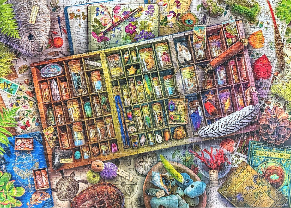 A detailed naturalist's collection featuring glass vials in a wooden organizer surrounded by biological specimens.